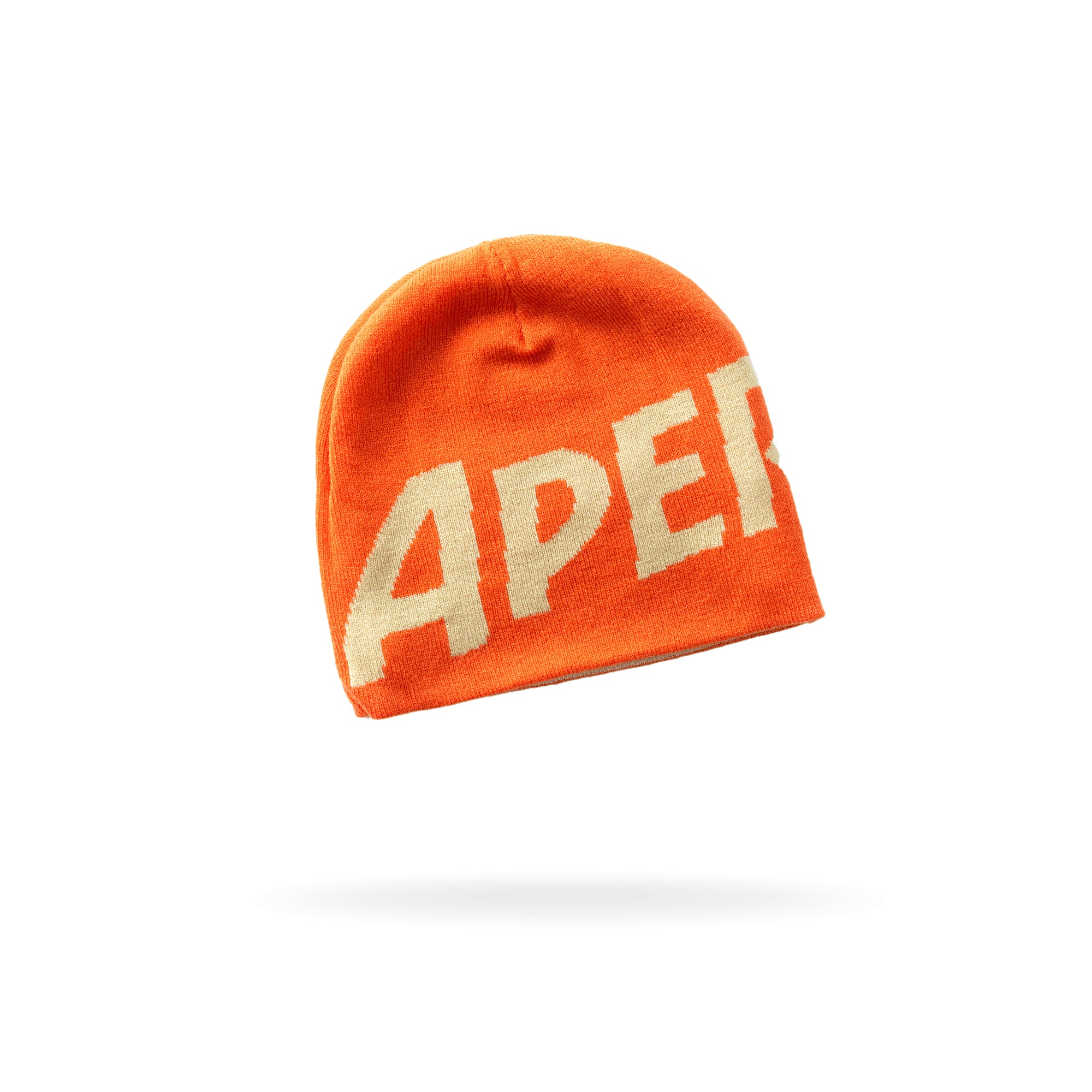 Orange winter beanie with the word “APEROL” in bold white capital letters on the front.